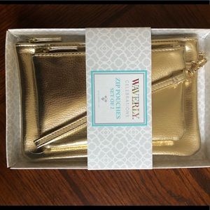 Set of (2) gold zip clutches